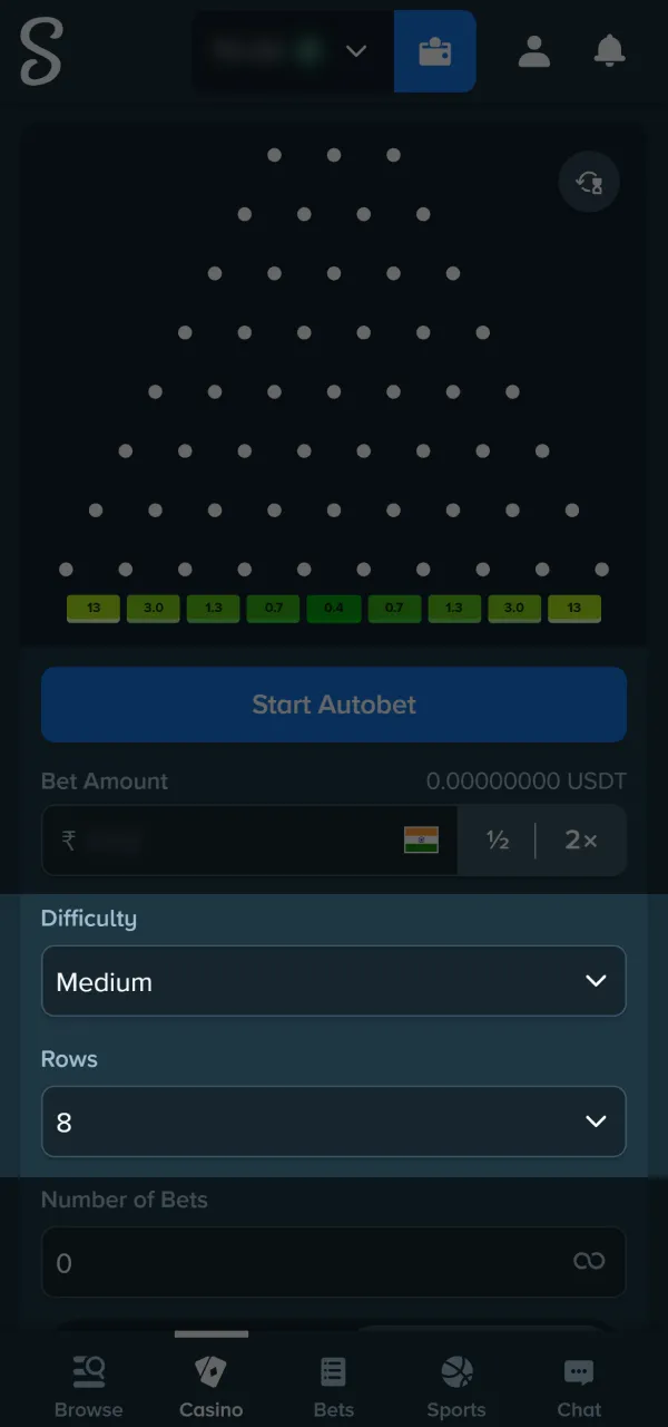 Select your risk level on the active Stake plinko board.
